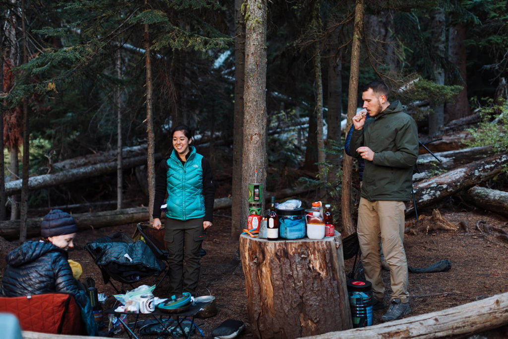 Couple preparing a camping meal