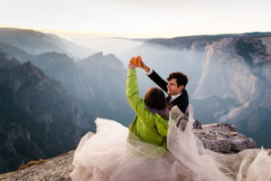 Bride and groom cheers after getting married at Taft Point