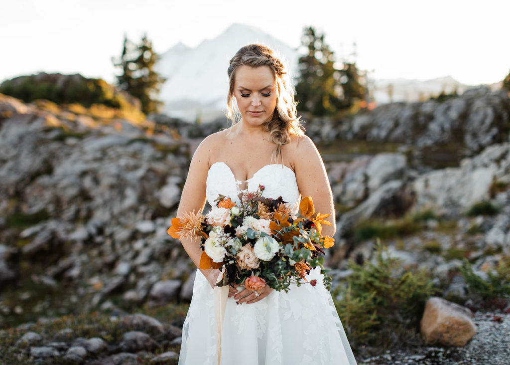 Bride holding her fall-themed bouquet