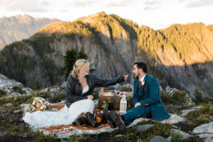 Married couple having a picnic in the mountains