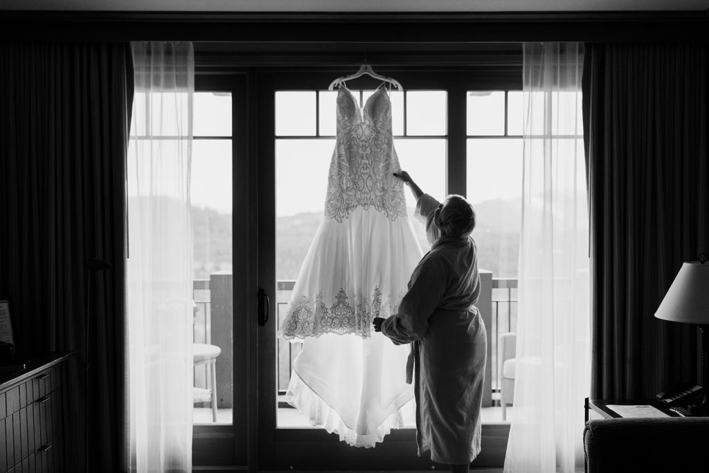 A bride putting her wedding dress on before getting married at Suncadia in Cle Elum