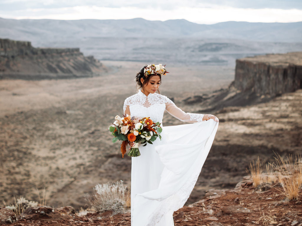 Bride posing in a Vietnamese inspired wedding dress at the Columbia River Gorge