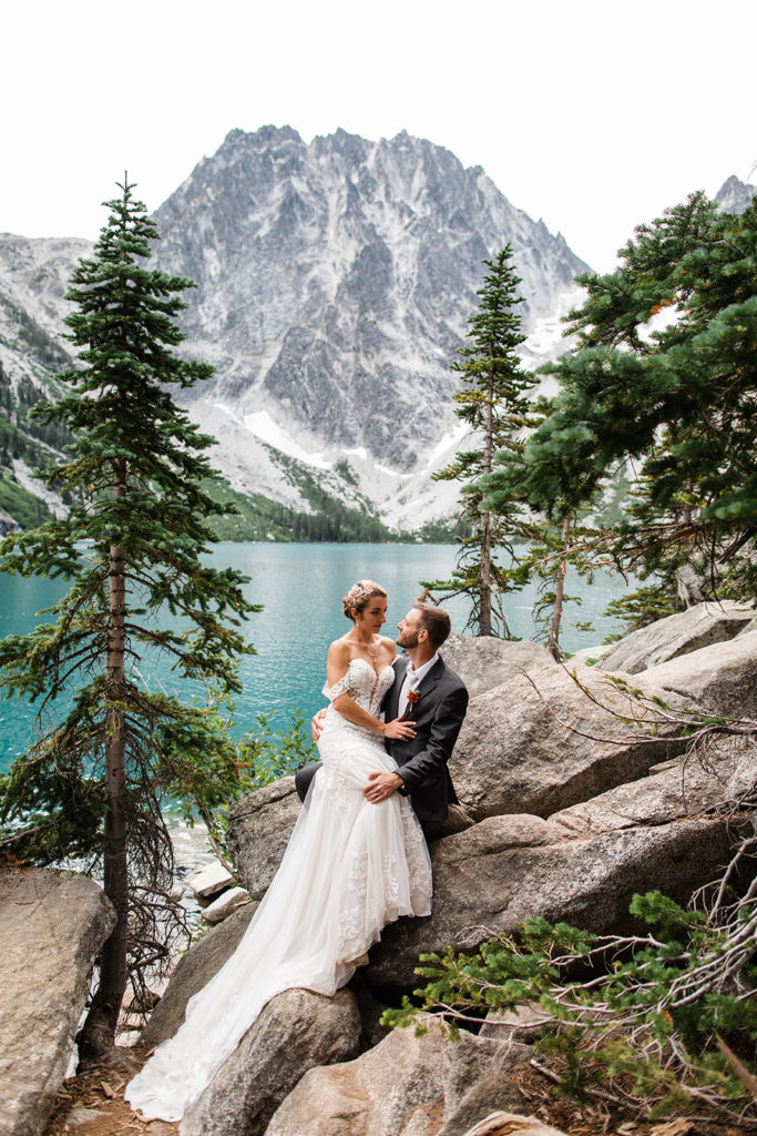 Newlyweds embracing at Colchuck Lake